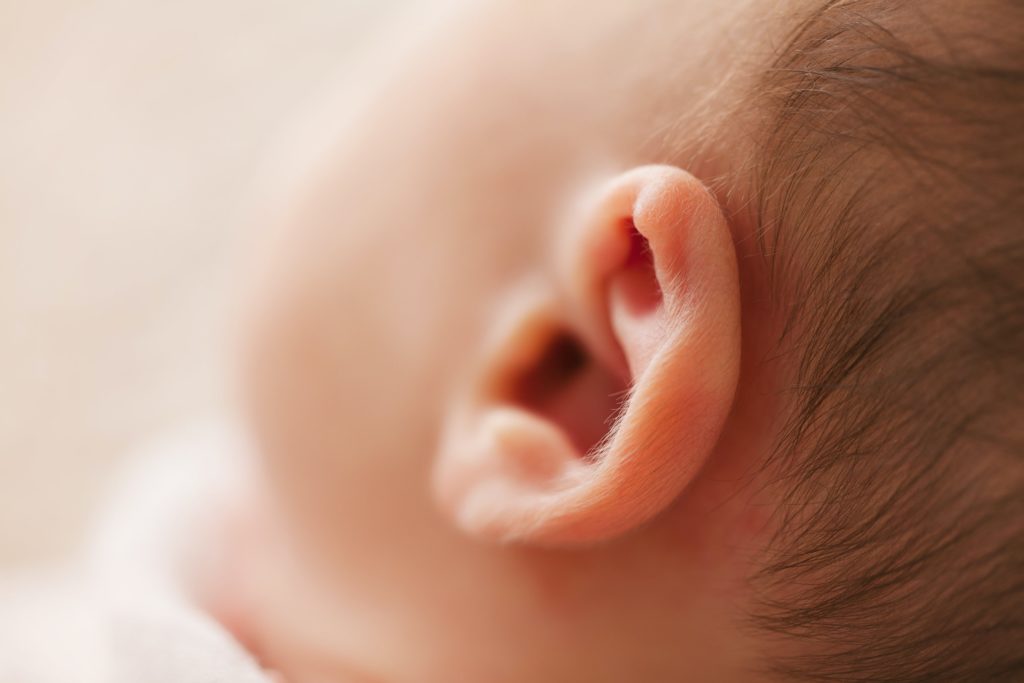 A photo of a baby ear. baby's ears pierced