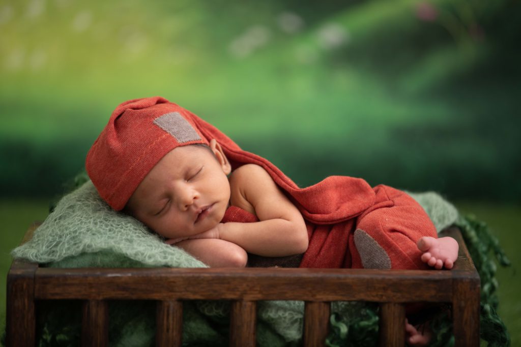 A photo of a newborn sleeping How much sleep does a newborn baby