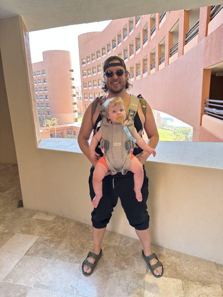 Dad with baby in a baby bjorn carrier