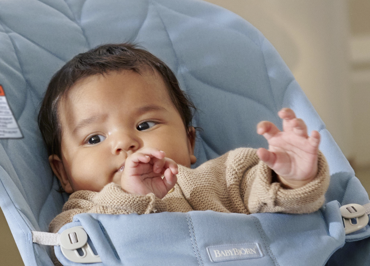 a baby in a baby bouncer